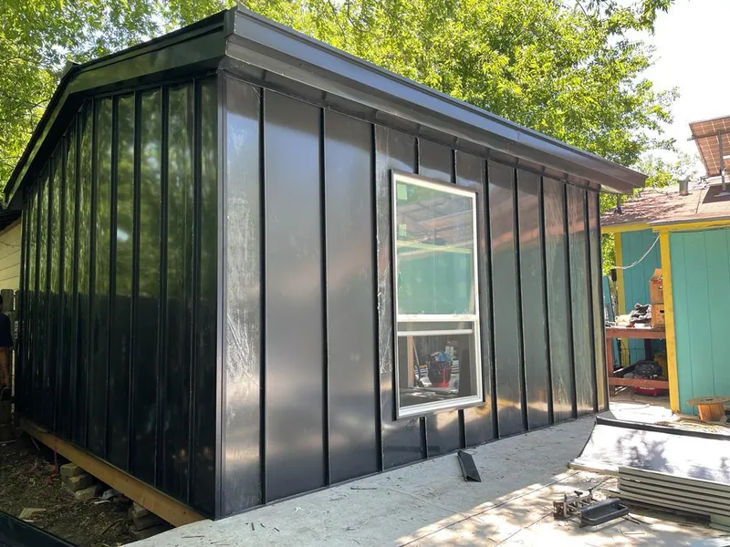 Black standing seam metal wall panels for Roof Inspection in New Square